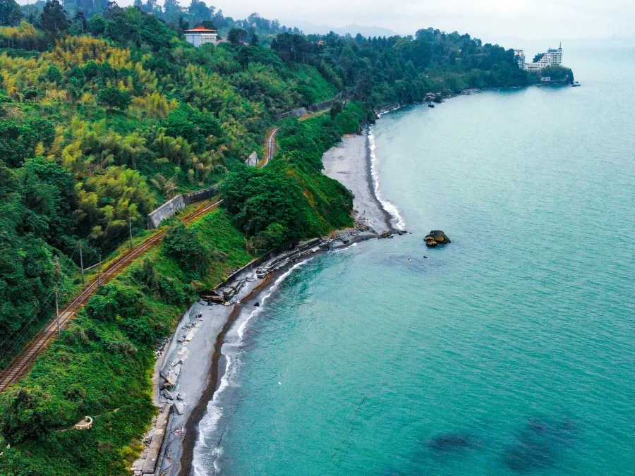 The green Adjara coast with a railway along the sea, seen from above