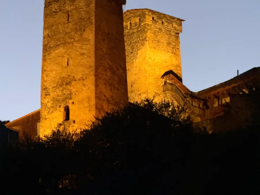 Svan towers in Mestia lit up in the evening