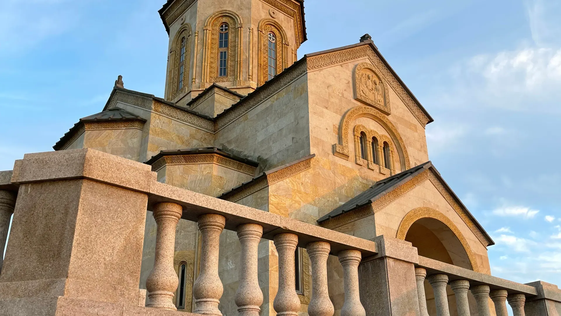 Sameba monastery church above Batumi on a stone terrace in the evening light