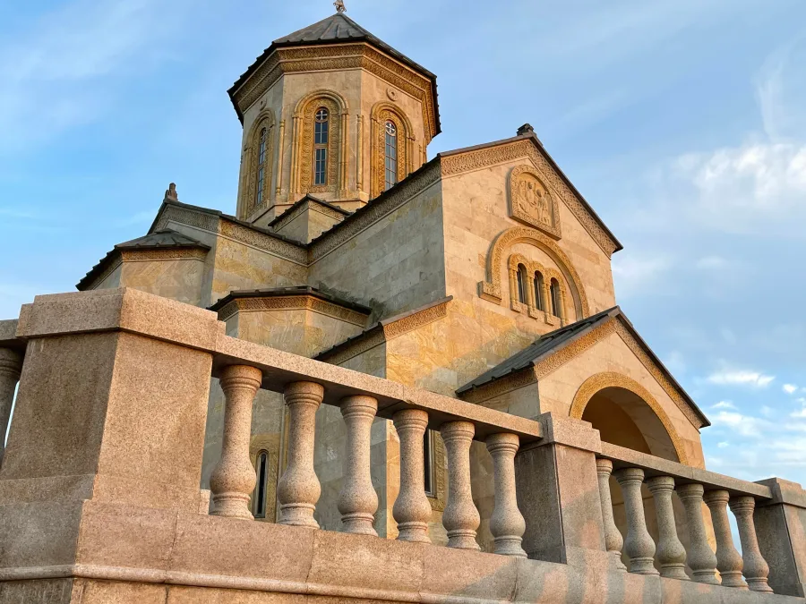 Sameba monastery church above Batumi on a stone terrace in the evening light