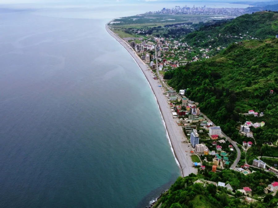The Adjara coast from Gonio towards Batumi from above: pebble beach and resort houses