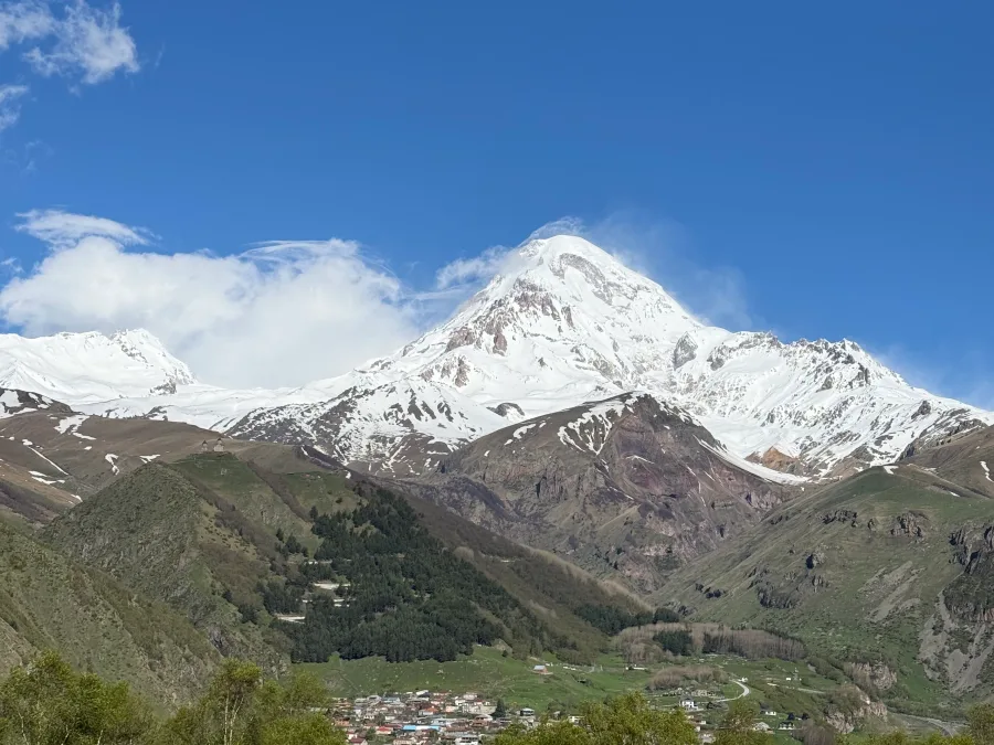 Snow-capped Mount Kazbek above Stepantsminda on a clear day